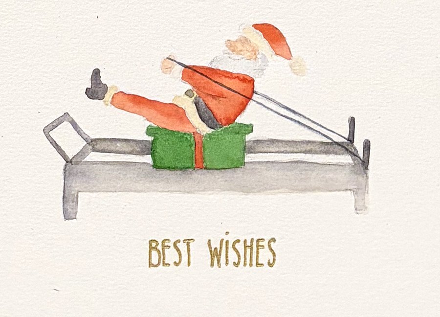 Hand-painted card: Santa doing Pilates on a reformer, with 'Best wishes'